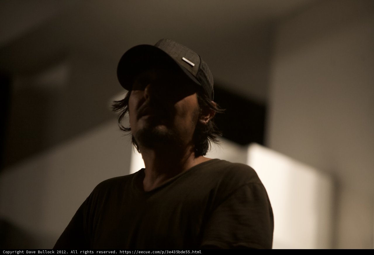 The Man in the Dim Baseball Cap