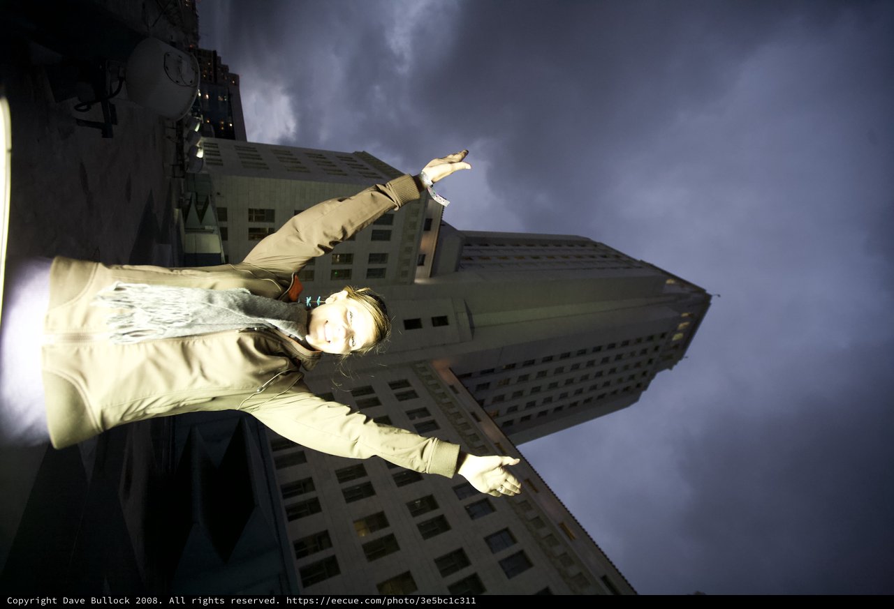Urban Triumph Beneath Stormy City Hall Skies