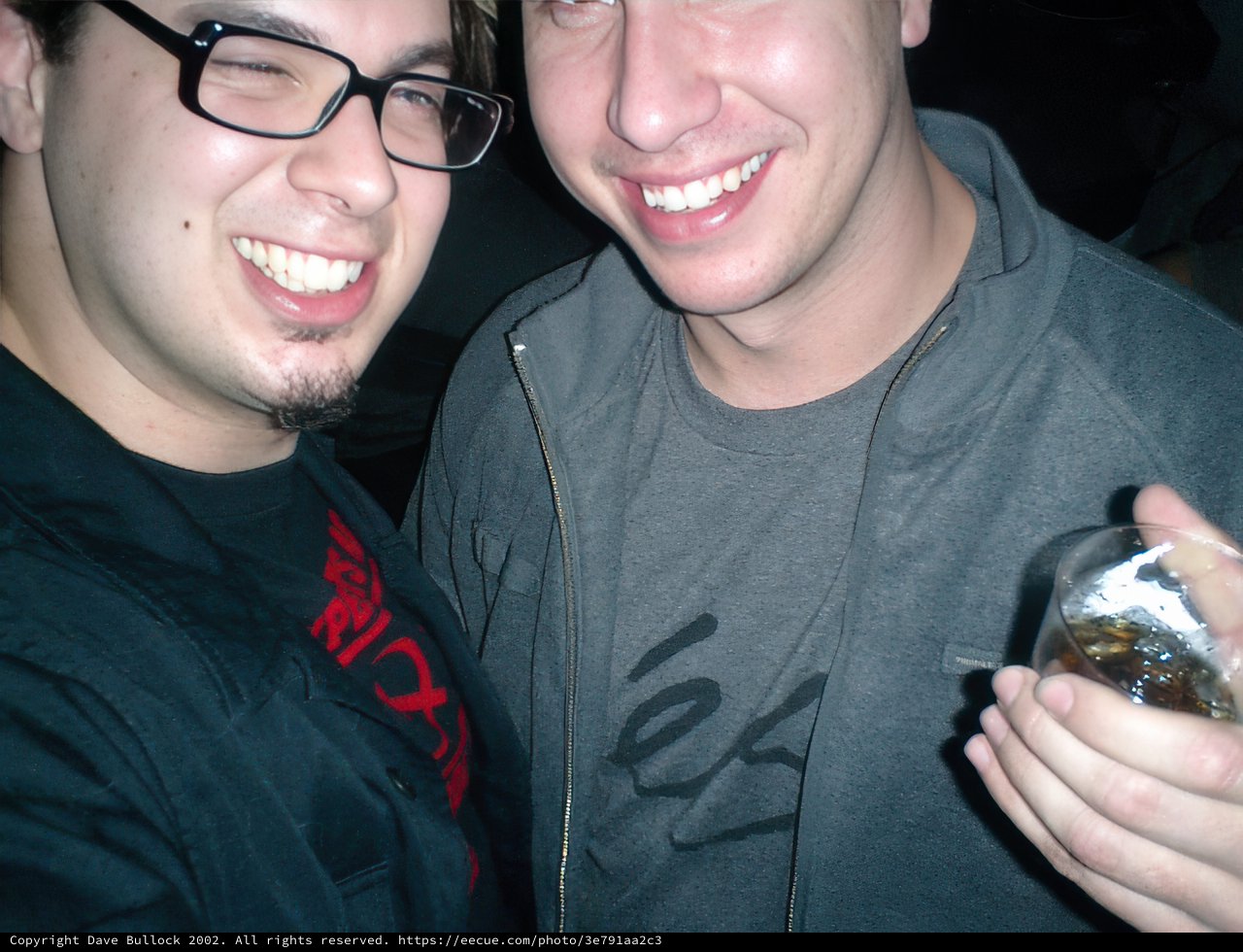 Smiling Friends Holding a Spoon