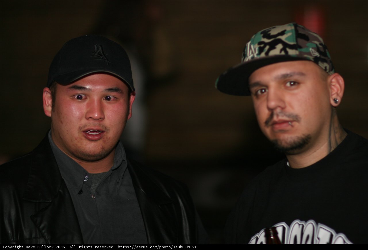 Two Men In Baseball Caps