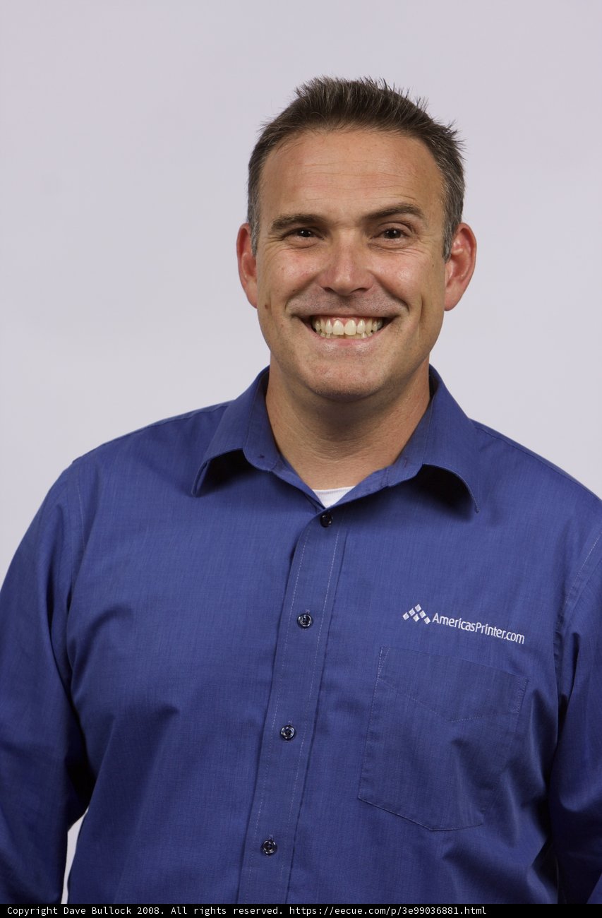 Happy man in blue shirt
