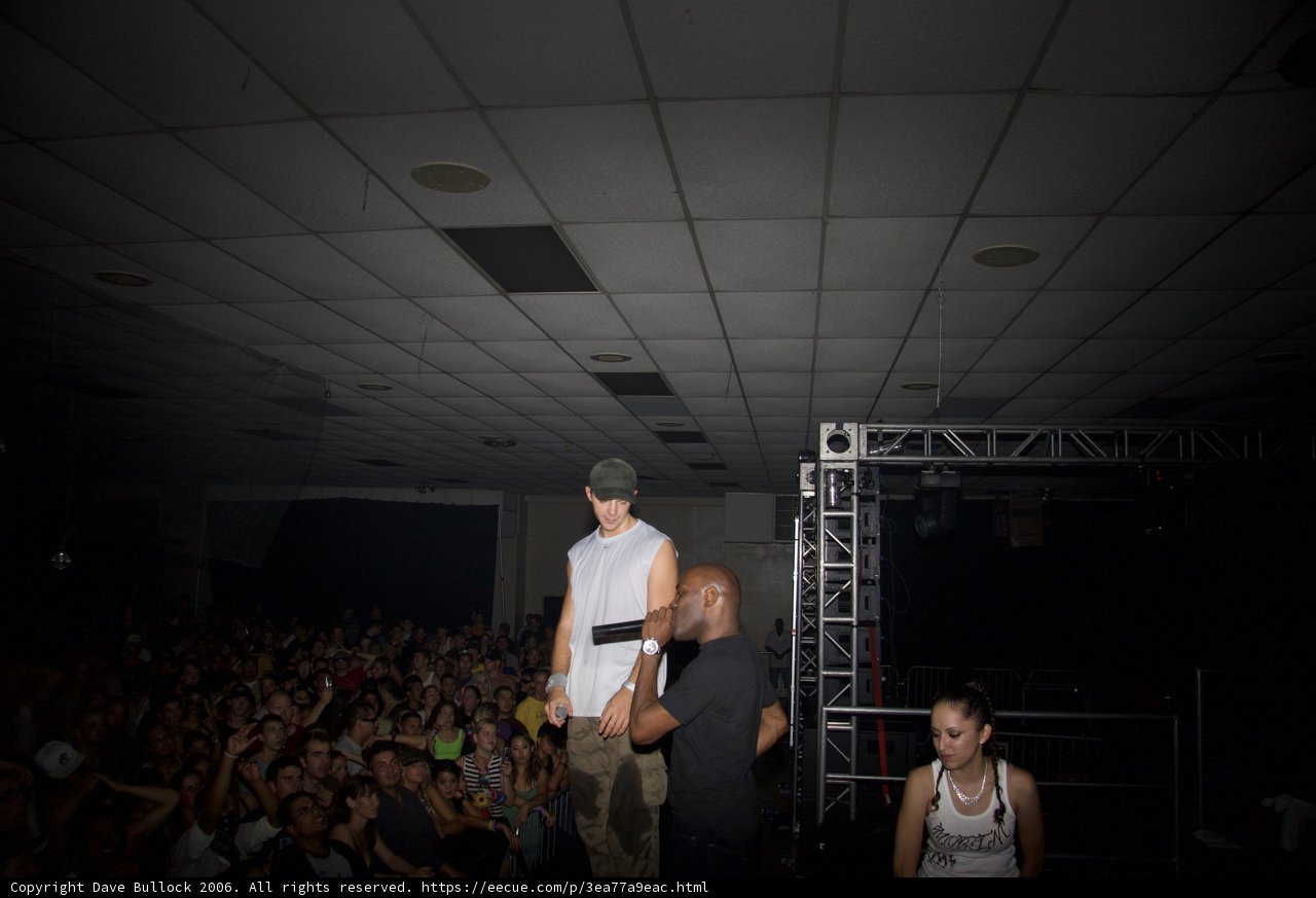 Man on Stage with Enthusiastic Crowd