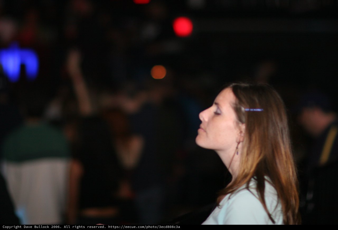 Young Woman Lost in Thought at Nightclub Event
