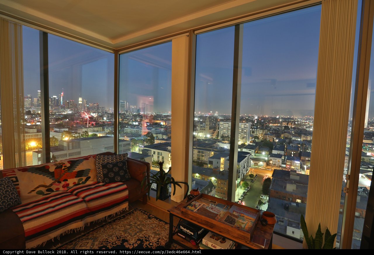 Nighttime cityscape from a Penthouse living room