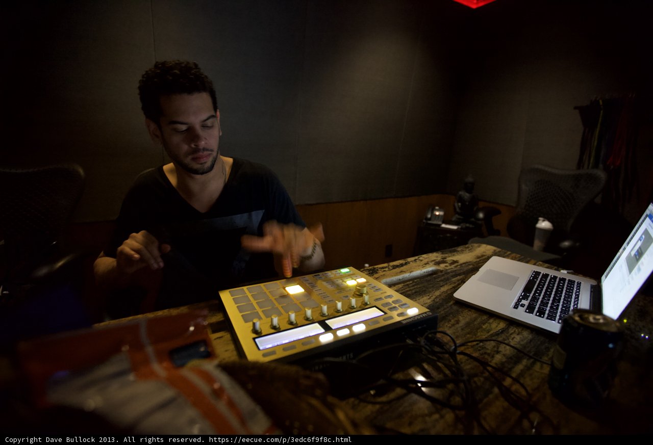 Man Mixing Music on Laptop