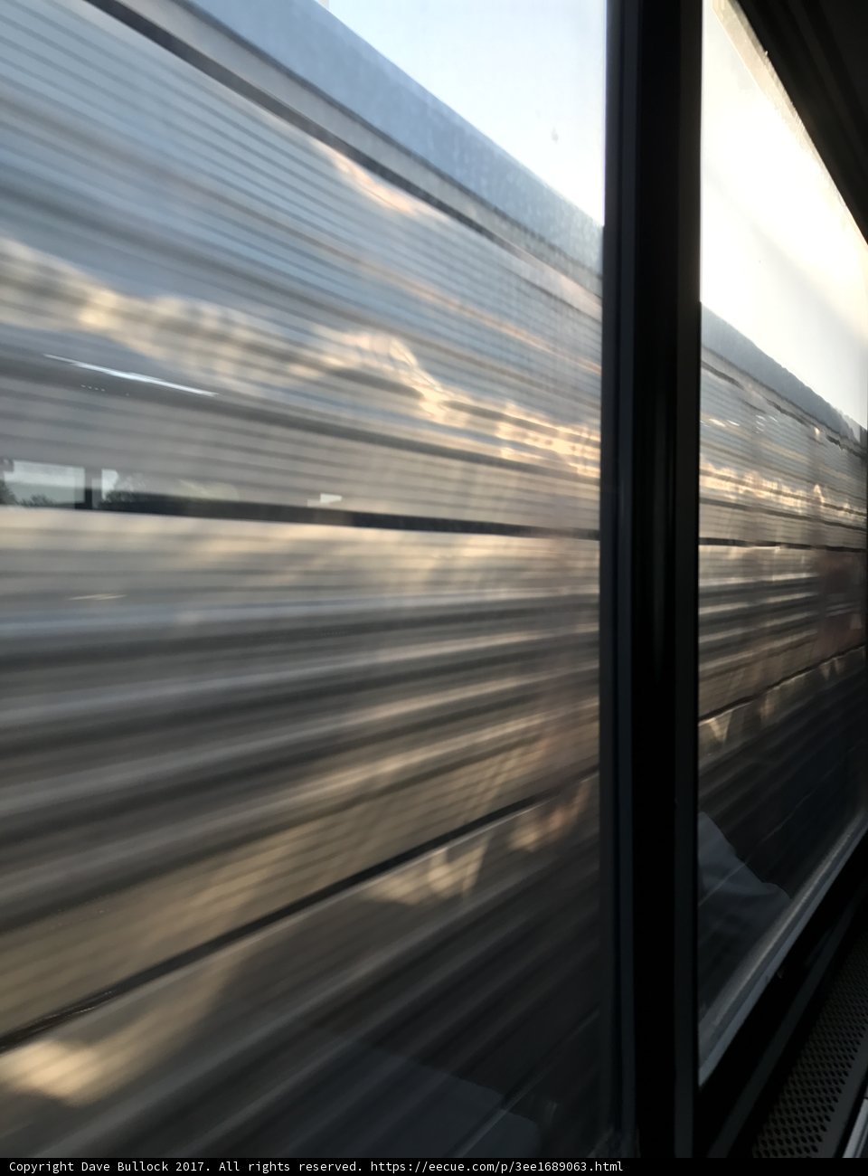 Train Window View of Terminal and Water Body