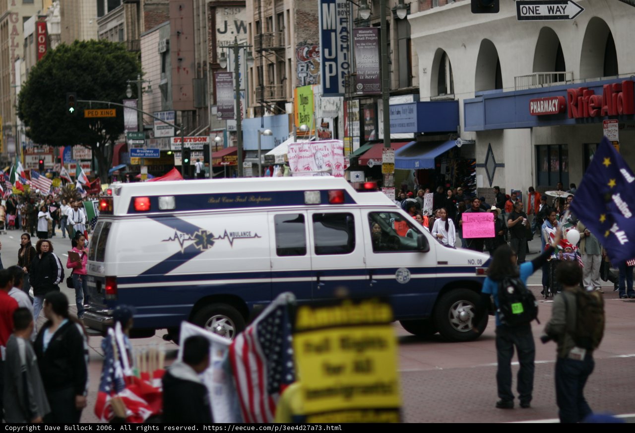 Student Protesters and Ambulance on City Street