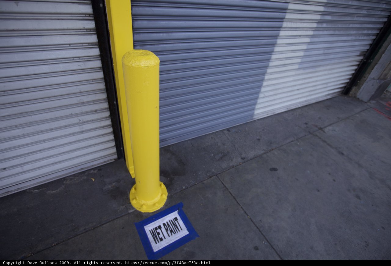Yellow Pole with City Sign