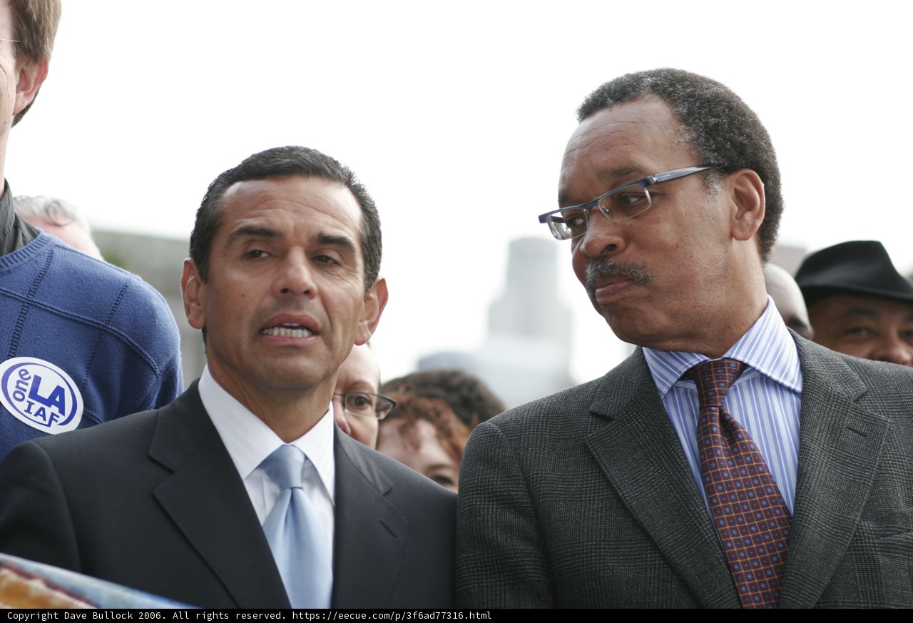 Two Men in Suits Stand Together