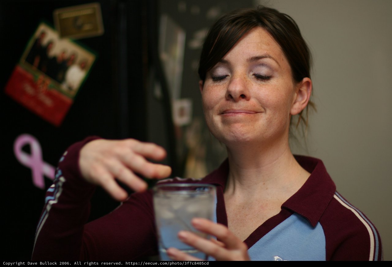 Woman Making a Face While Holding Drink