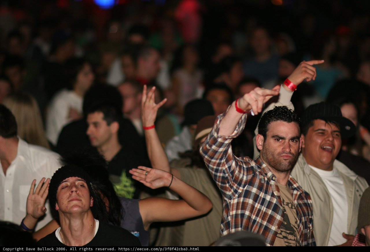 Plaid-Shirted Man in an Urban Crowd