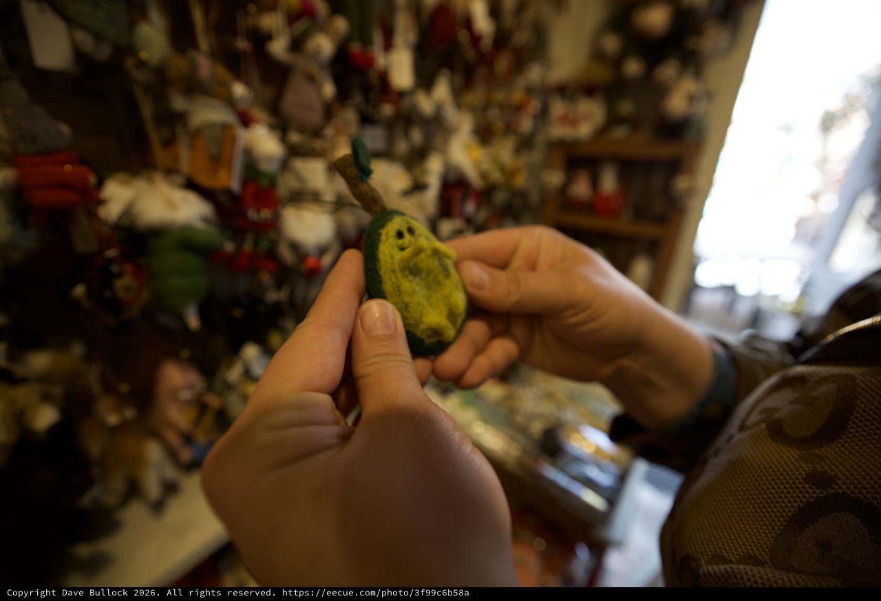 Examining a Jade Ghost Figure in Santa Fe Shop