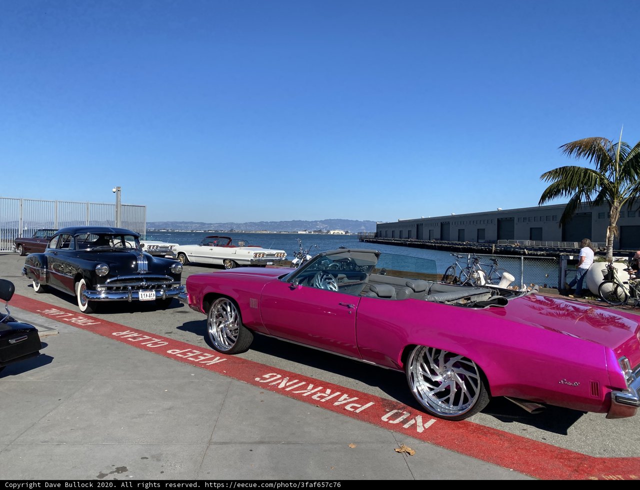 Pink Convertible and Boat at the Waterfront