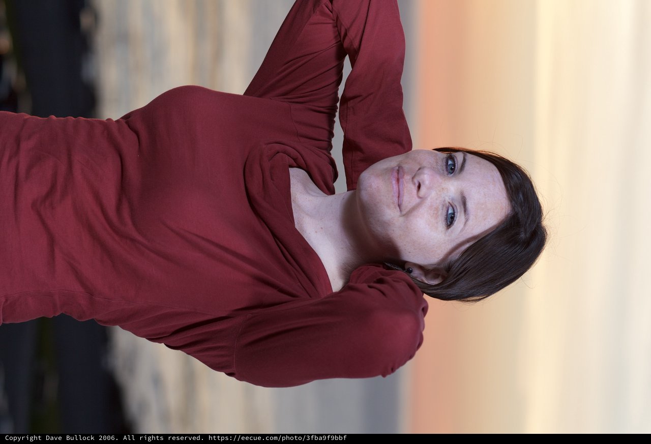Woman in Crimson at Golden Hour Seaside
