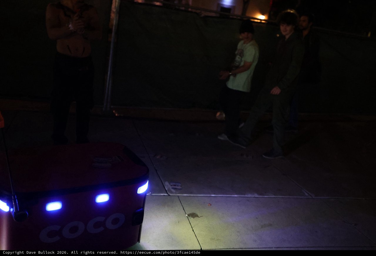 Coco Delivery Robot Navigates Nighttime Festival Crowd