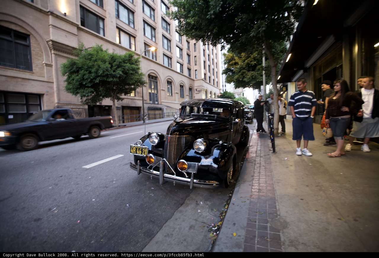 Antique Black Coupe Parked on City Street