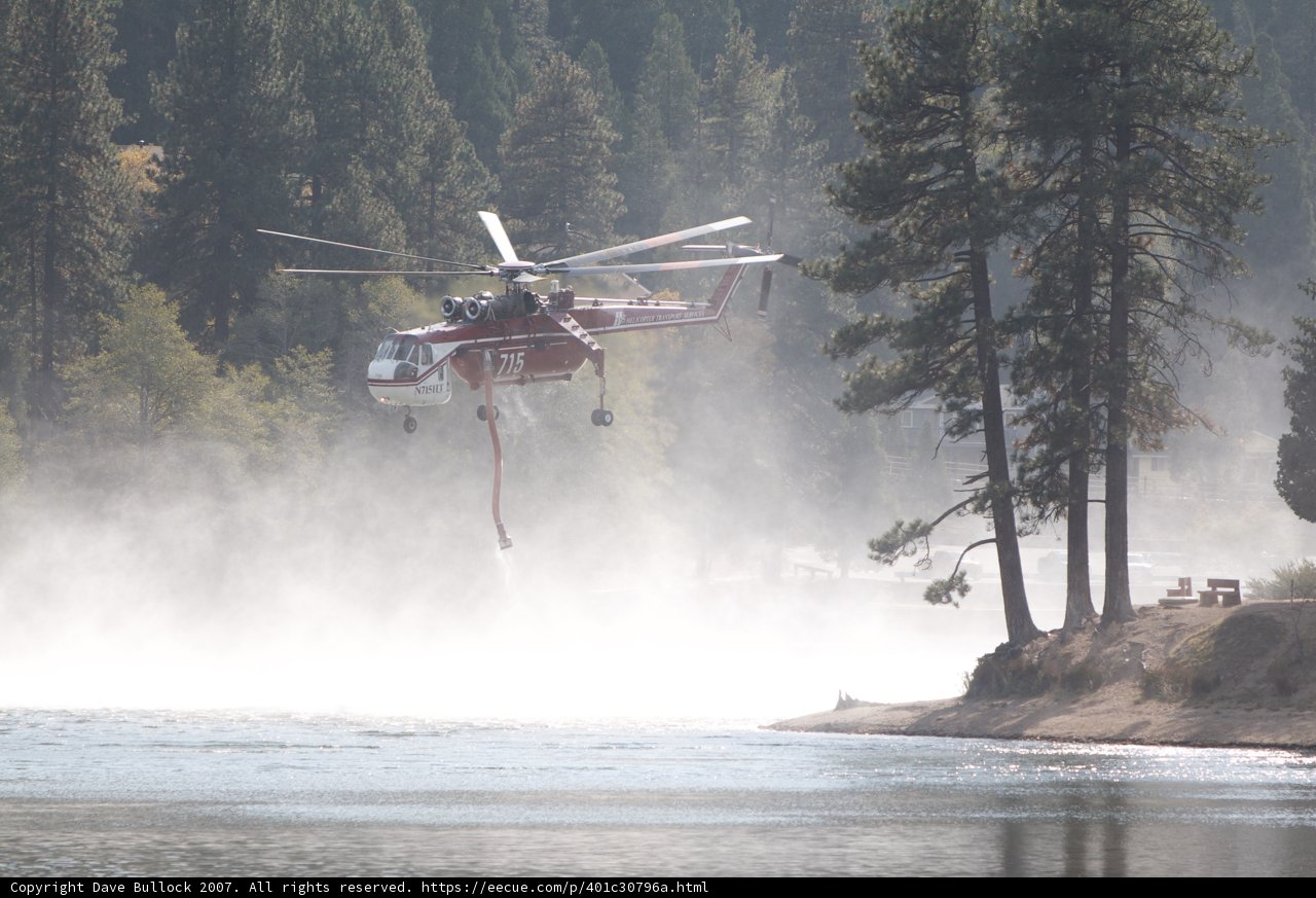 Helicopter Fighting Wildfires Over River