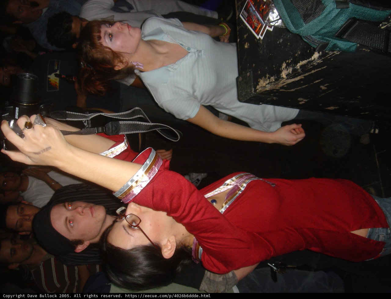 Red Shirted Woman in a City Club