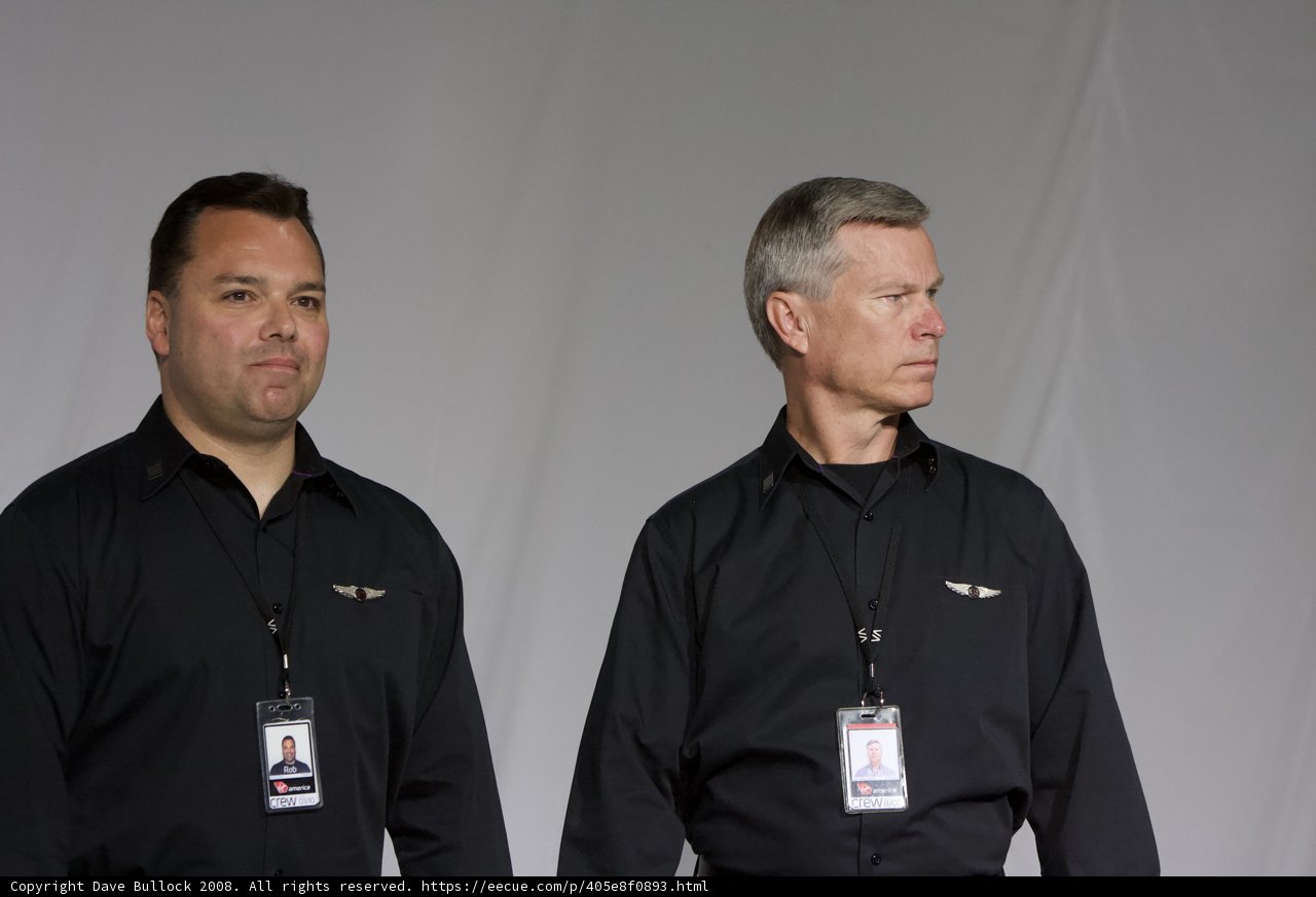 Two Men in Black Shirts