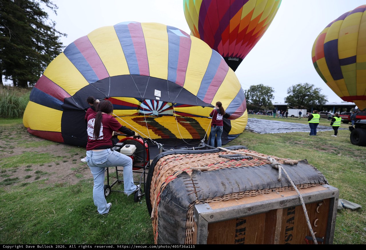 Volunteer Crew Inflating Hot Air Balloons at Dawn