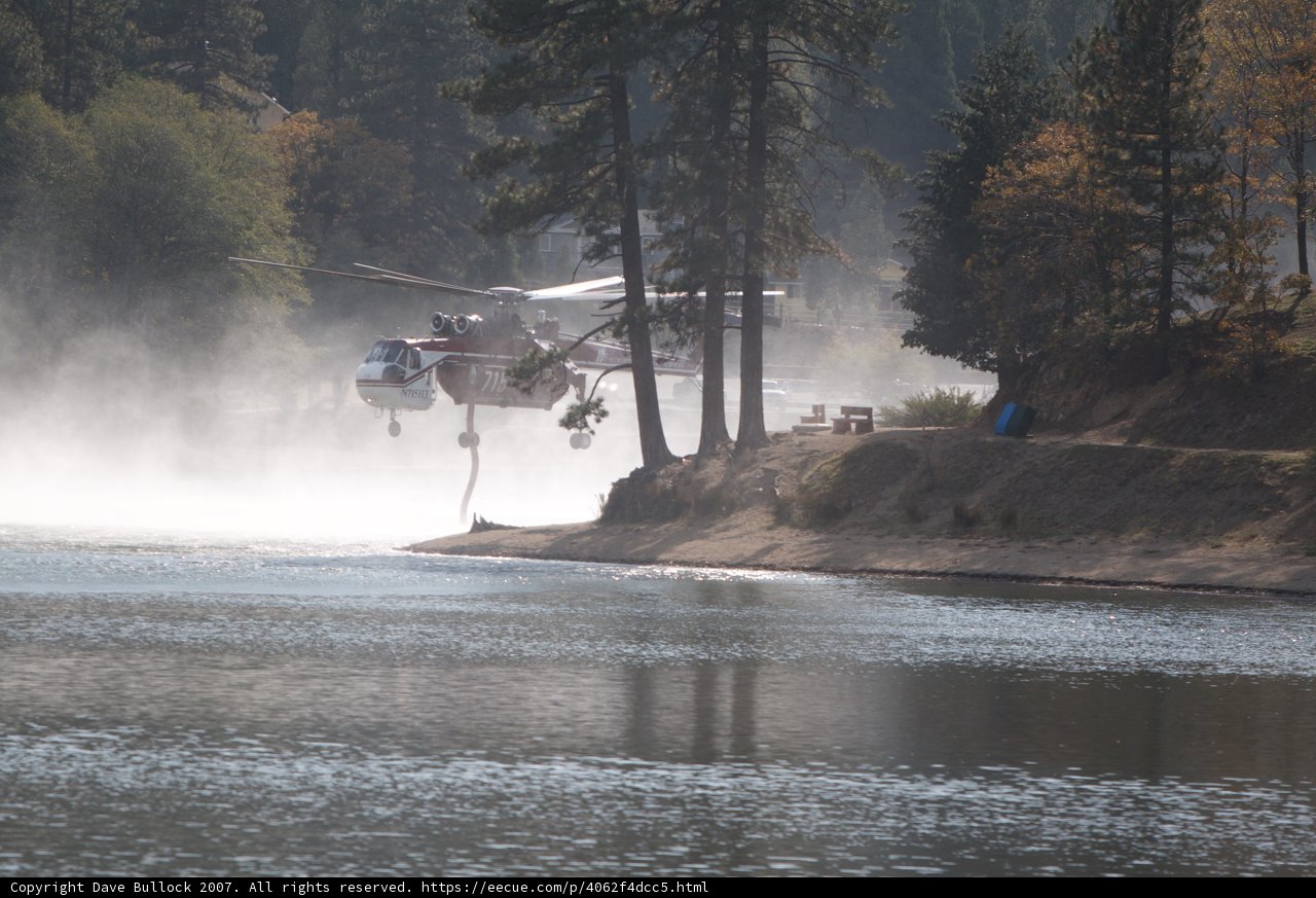 Firefighting Helicopter Sprays Water on Lake