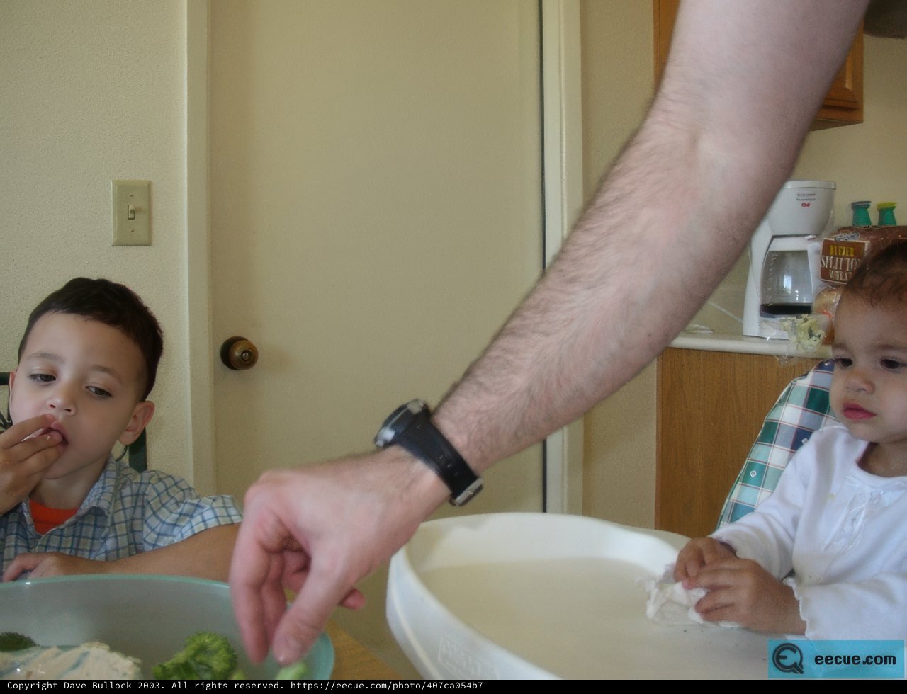 Father and Son Enjoying Mealtime