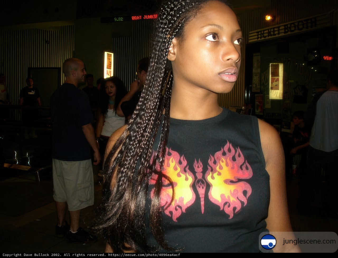 Young Woman with Braids in Black Shirt
