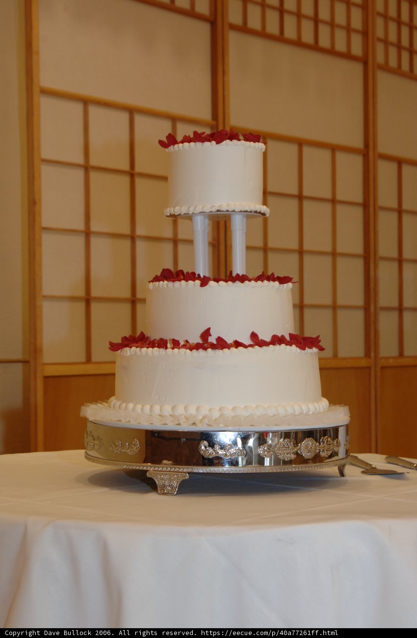 Three-Tiered Wedding Cake with Red Roses