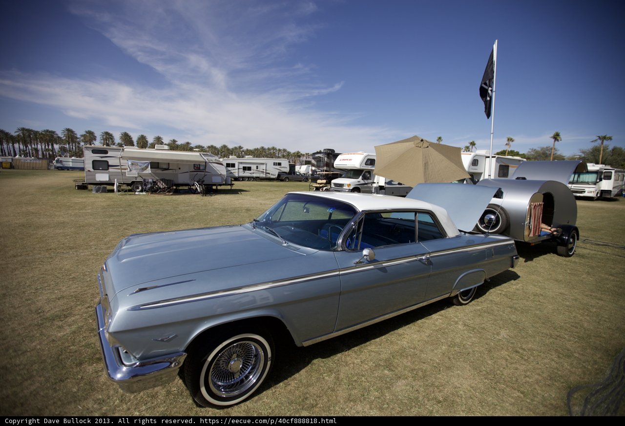 Vintage Car Rests Next to Trailer at Coachella