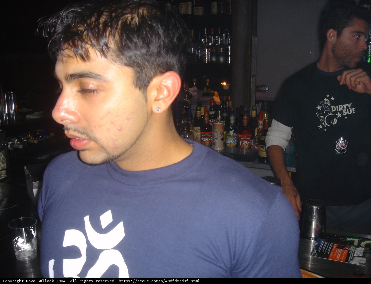 Two Men Drinking at a Bar Counter