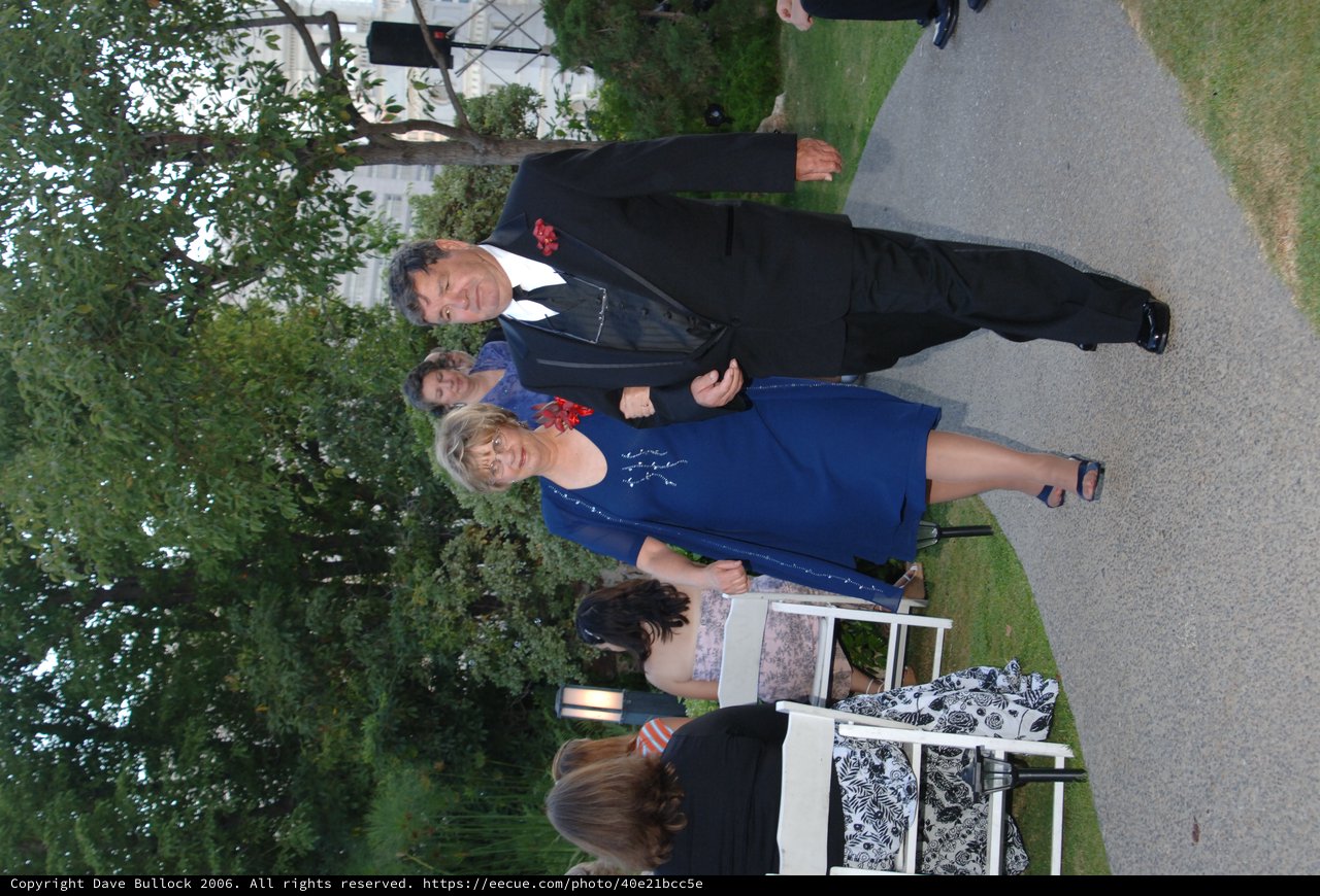 Elegant Couple Walking Down Wedding Aisle Outdoors