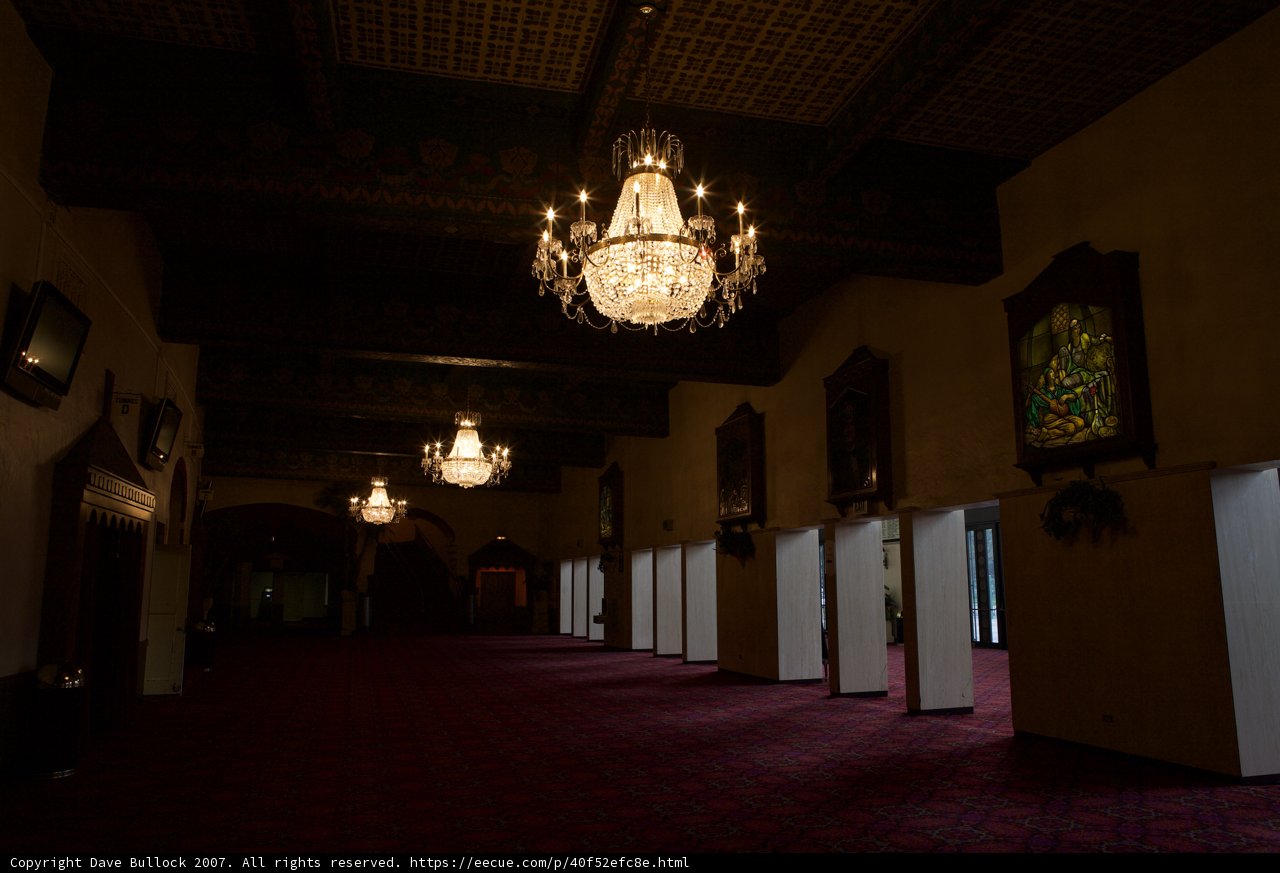 Grand Chandelier Illuminates Old Theater Lobby