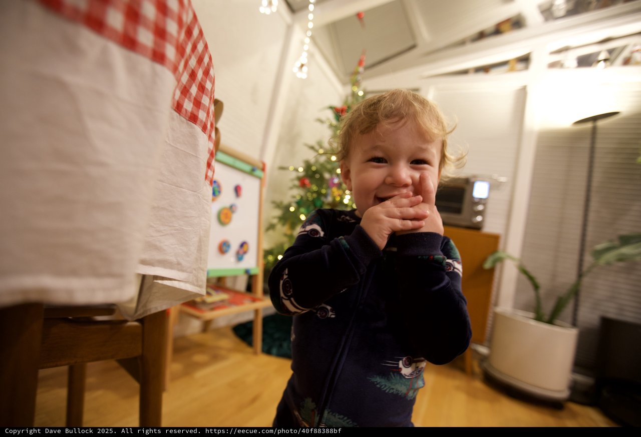 Toddler's Joyful Christmas Morning in Kitchen
