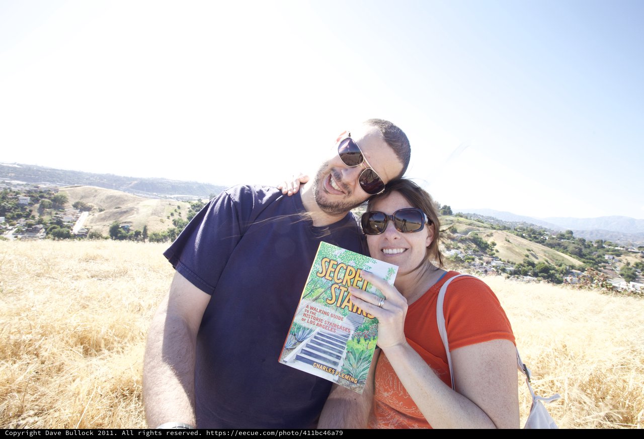 Couple Poses with Secret Stairs Book on LA Hillside