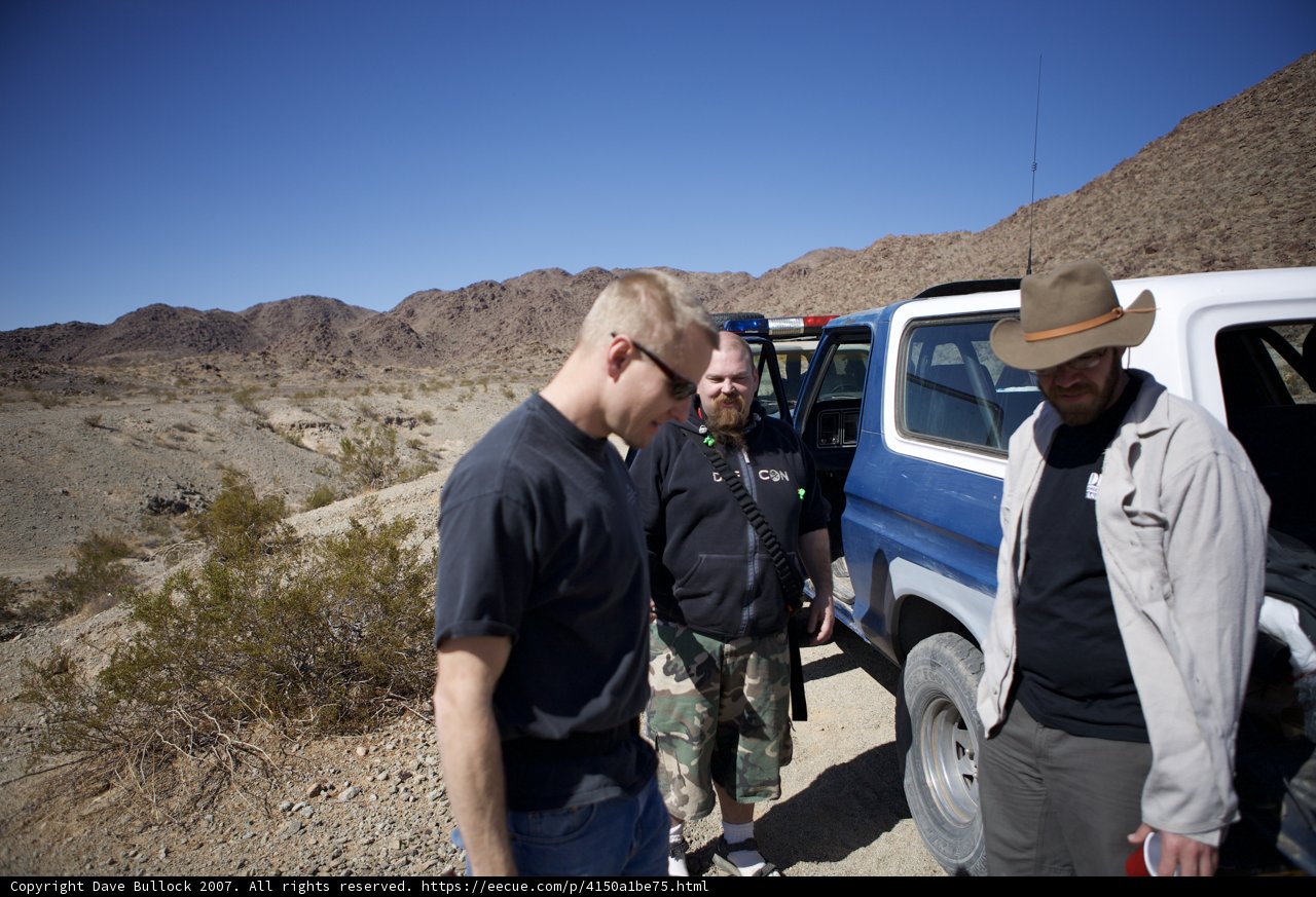 Group of Men and Their Truck on a Hilltop