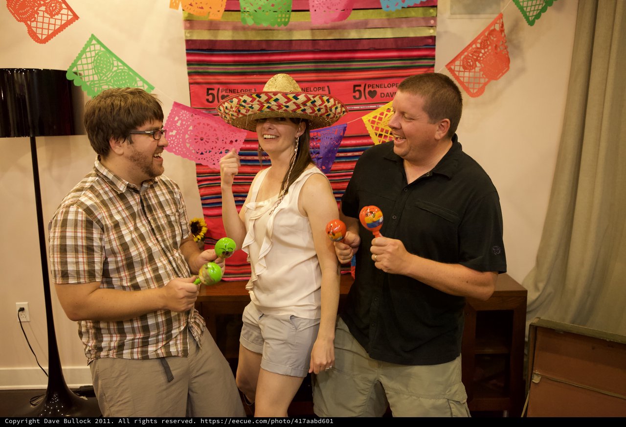 Friends Celebrate with Maracas at Fiesta Anniversary Party