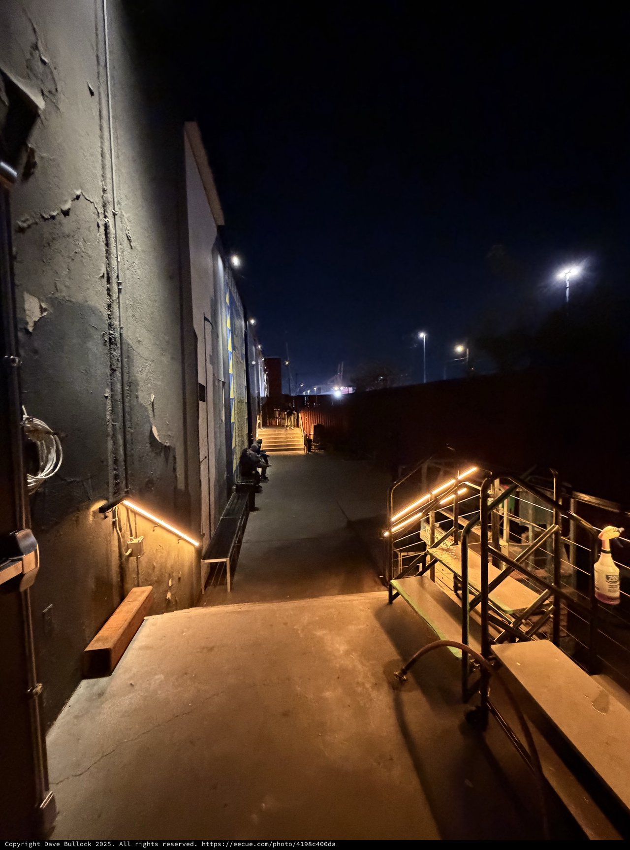 Illuminated Industrial Walkway at Dawn