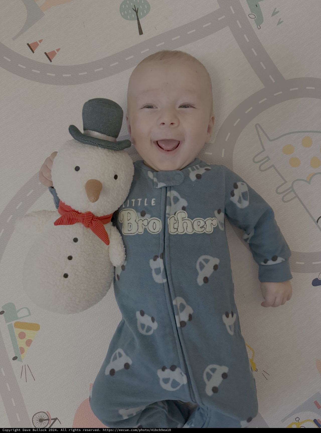 Joyful Baby with Snowman Plush Toy