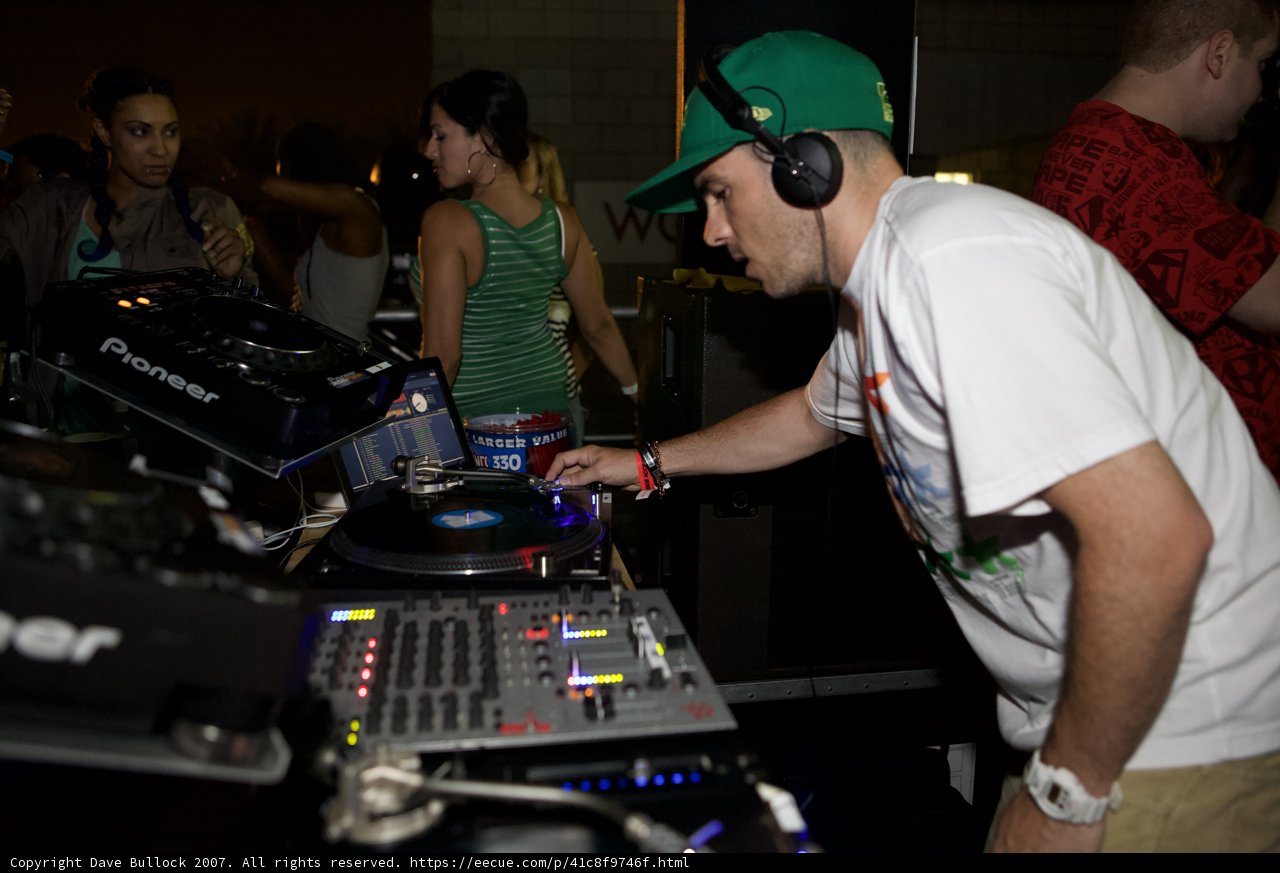 Green-Clothed DJ at Nightclub