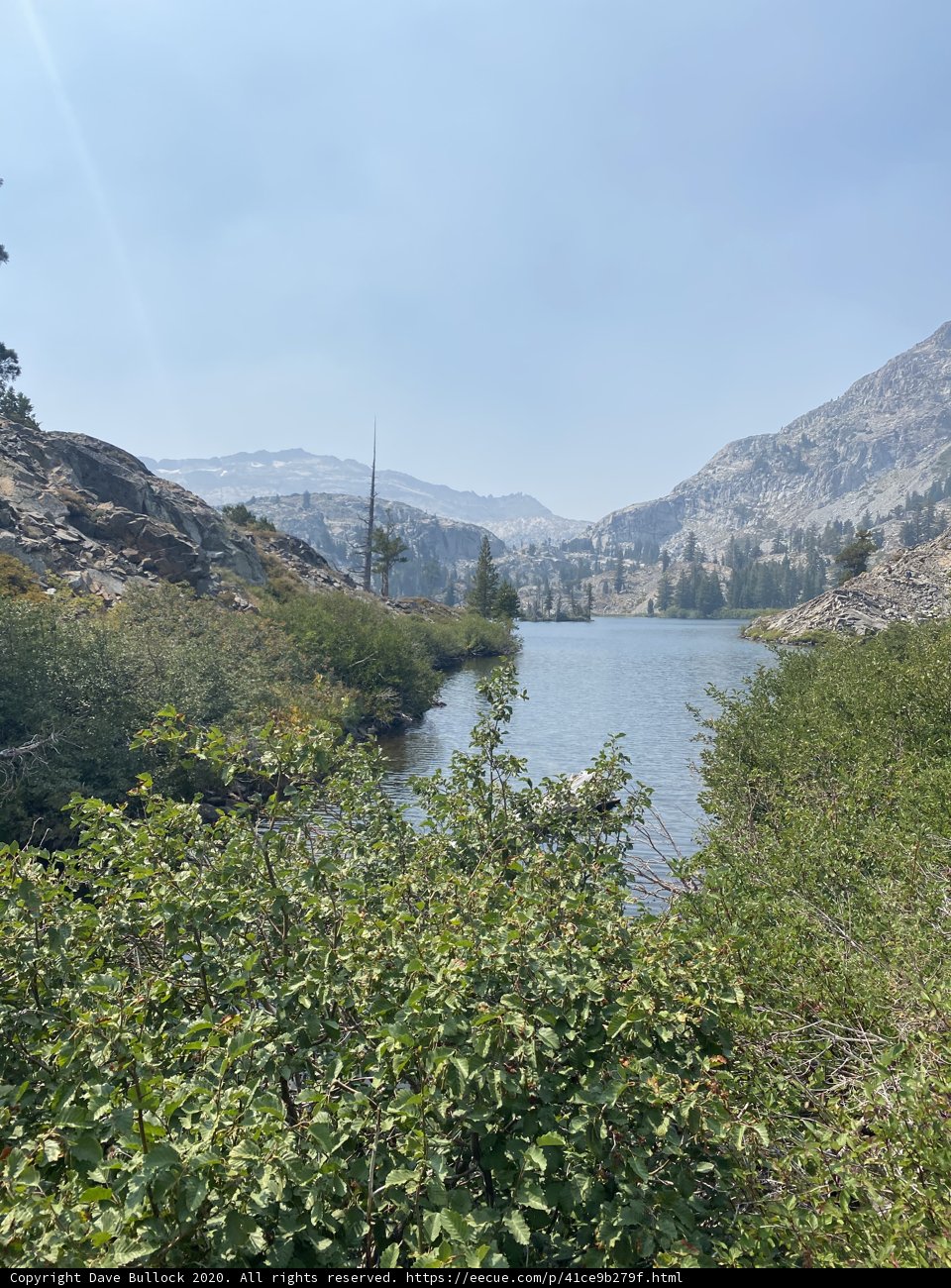 Serene Lake Amidst Towering Mountains