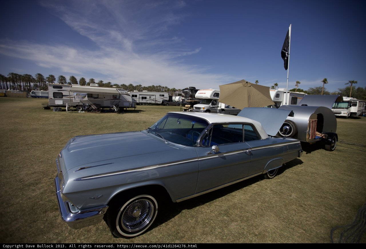 Classic car parked next to trailer