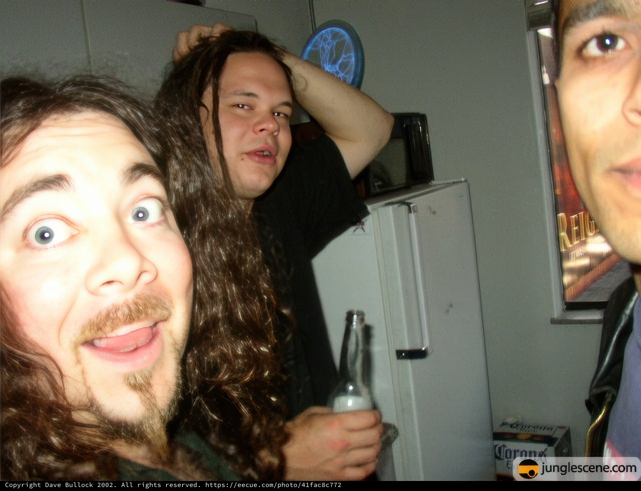 Long-haired Man with Beer Bottle and Refrigerator