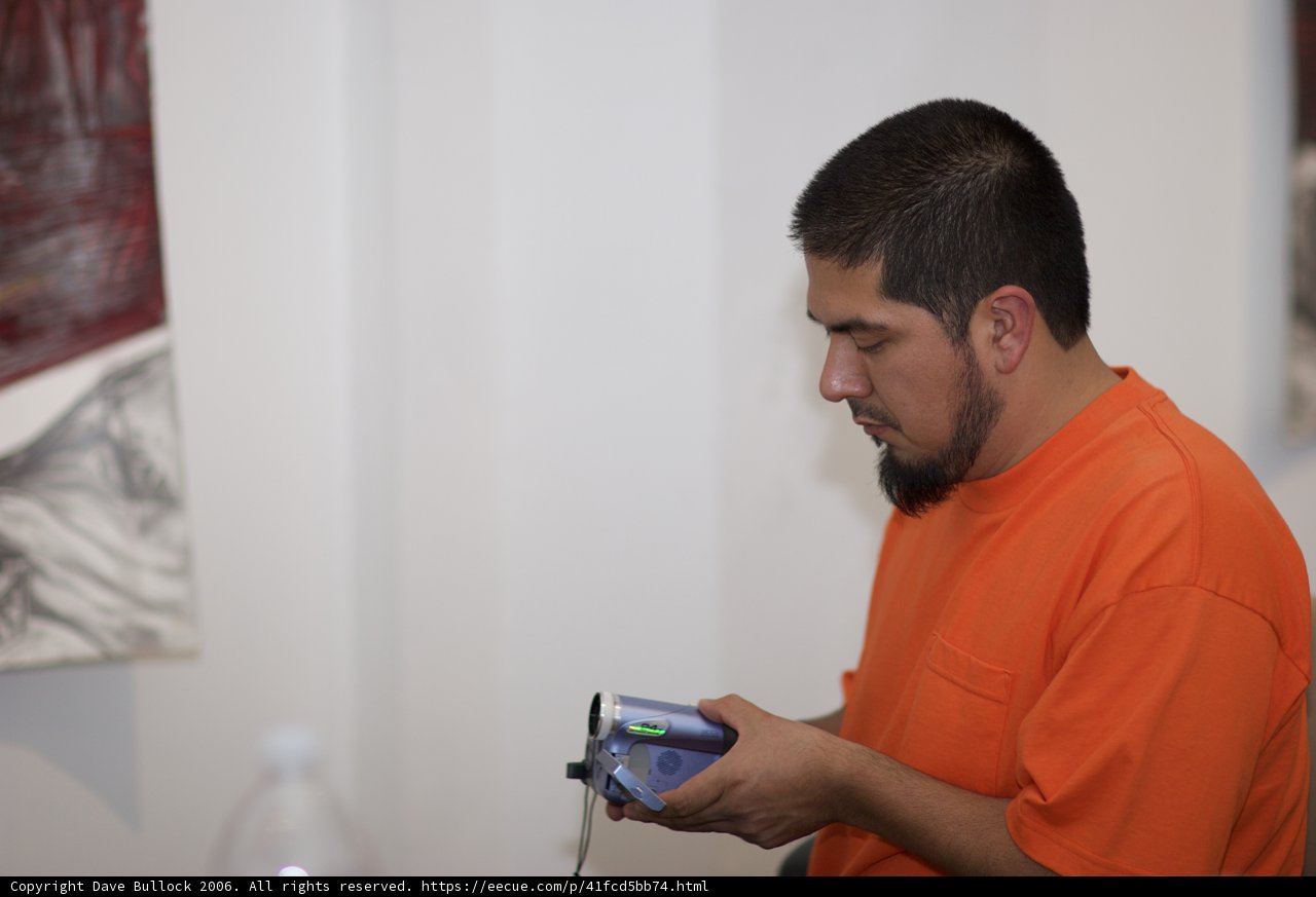 Curious Man in Orange Shirt