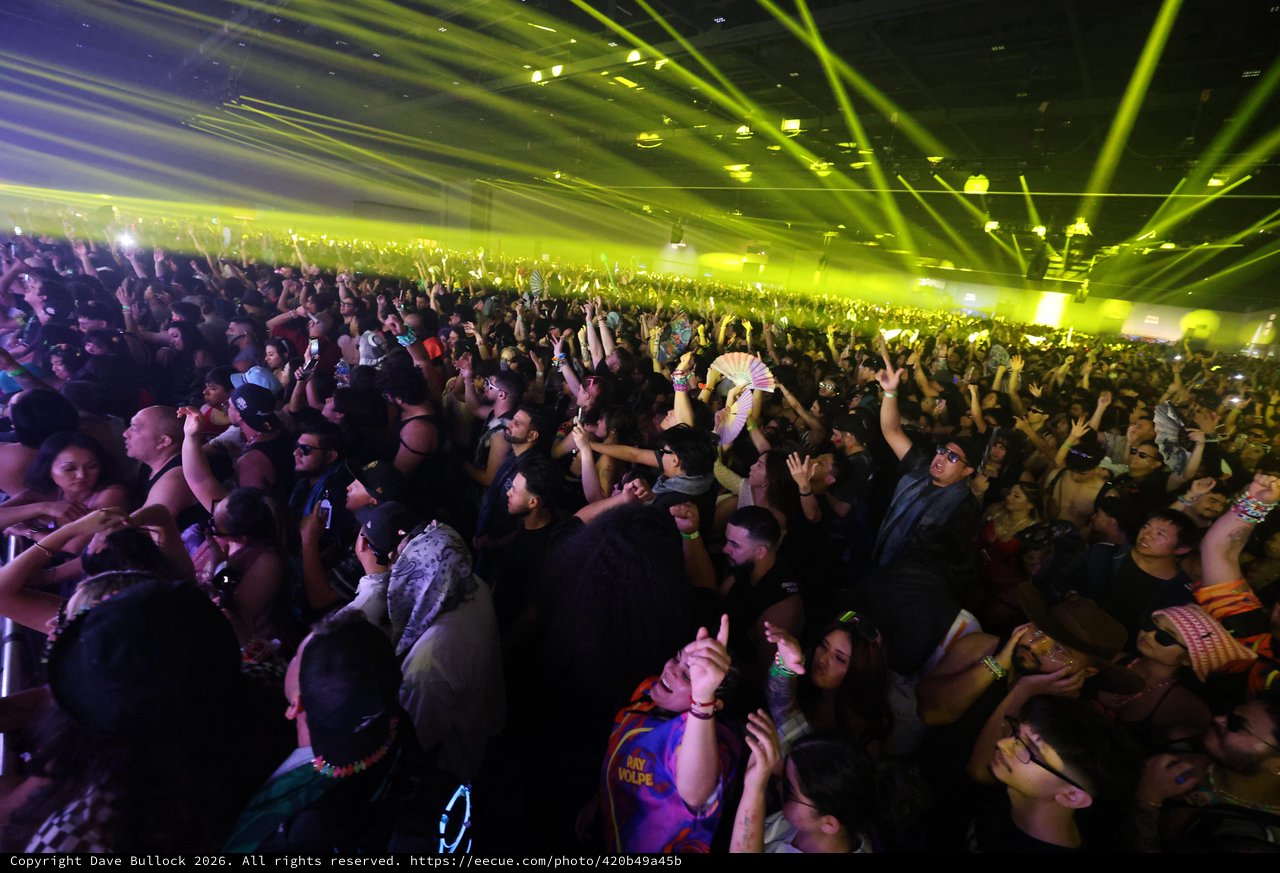 Massive EDM Crowd Surges Under Green Laser Light Show