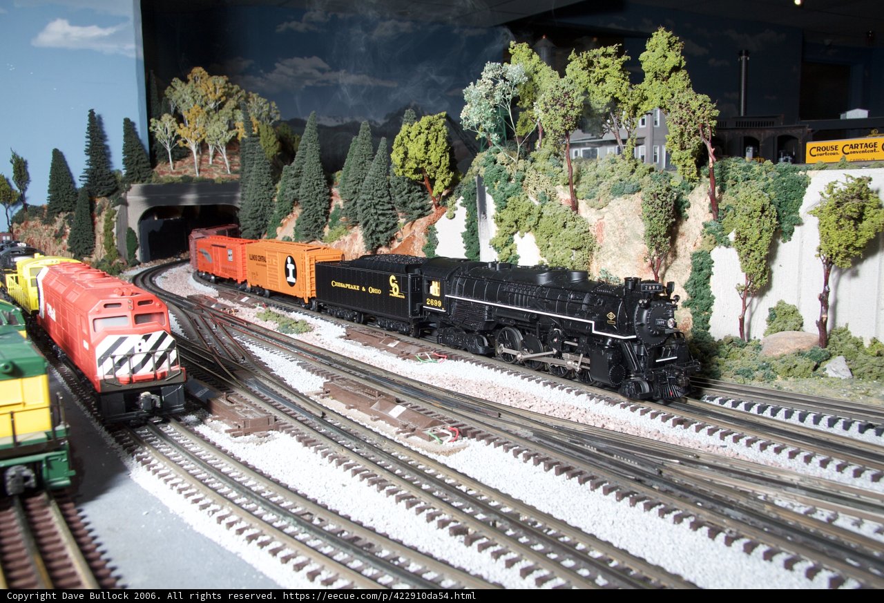 Model Train Chugging Through a Scenic Diorama