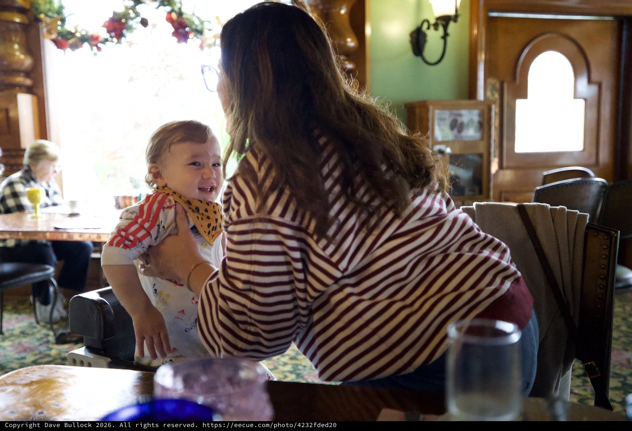 Mother and Child Share Joyful Moment at Restaurant