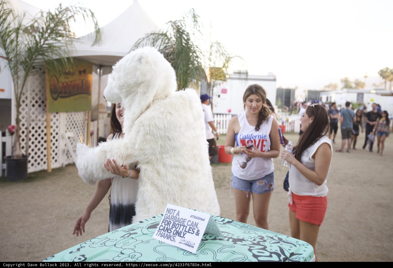 Woman posing with stuffed animal at Coachella