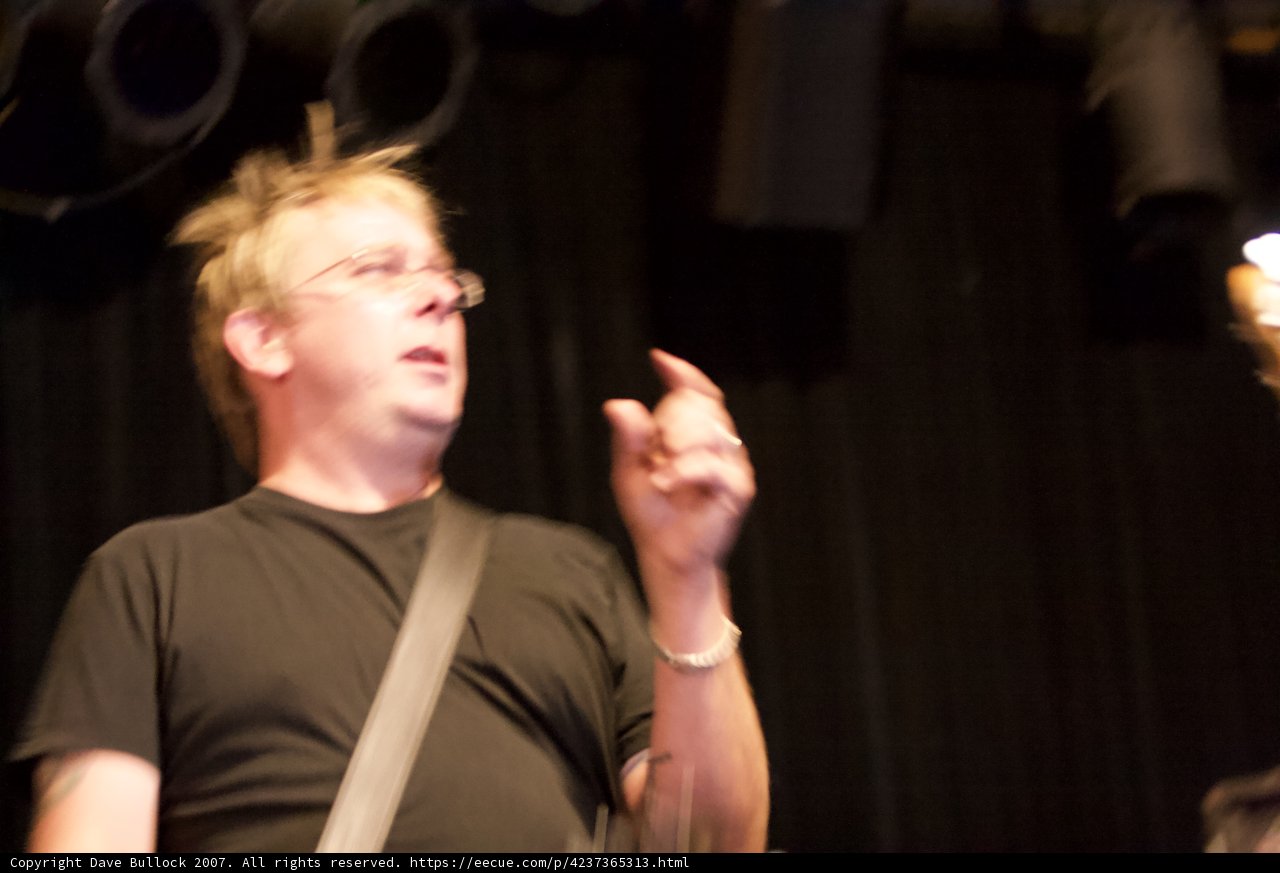 Brian Baker playing guitar at Glasshouse concert