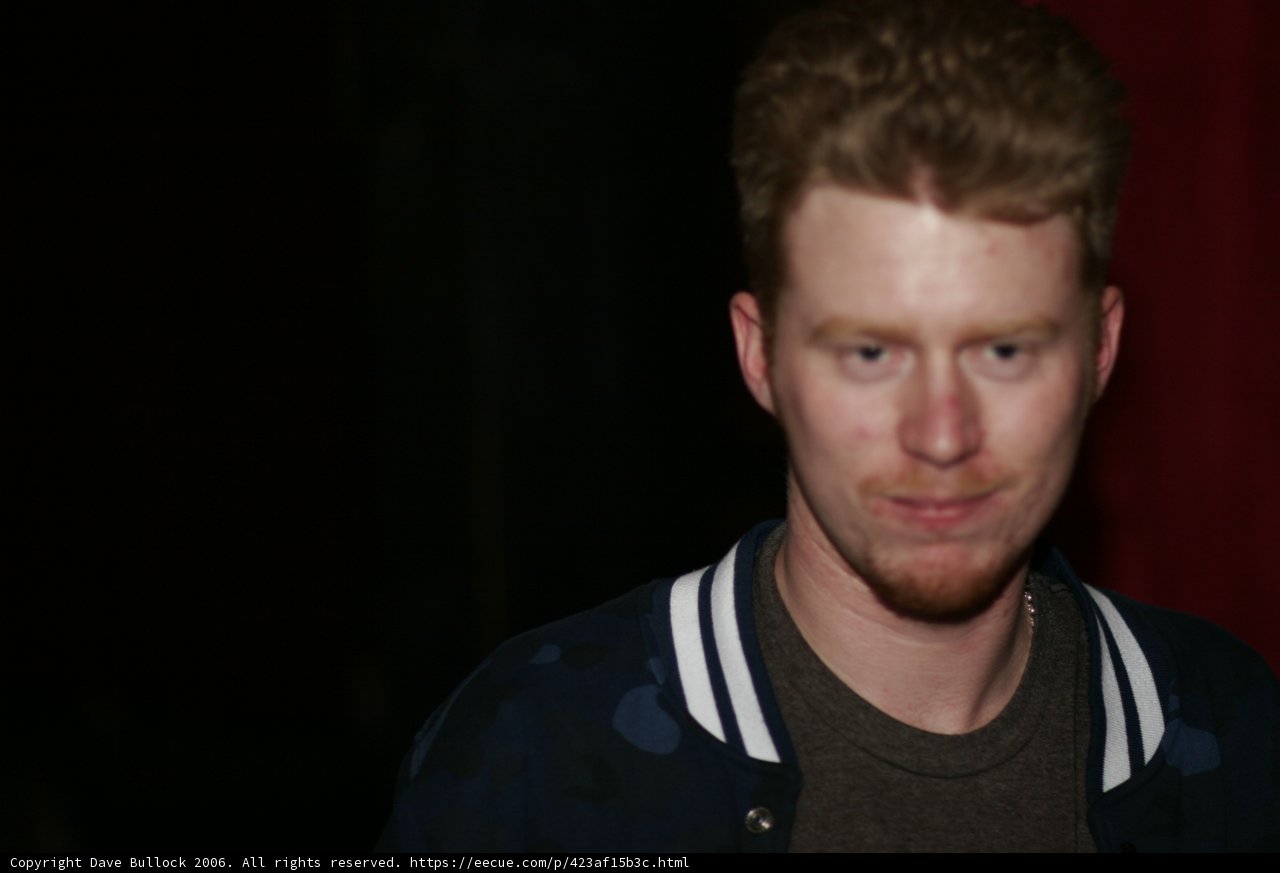 Smiling Man in Blue Jacket