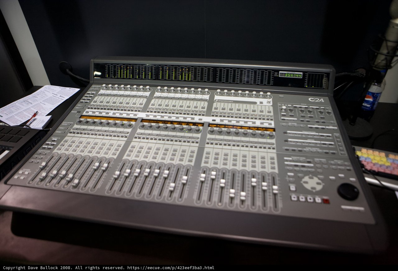 Studio Mixing Board with a Variety of Instruments